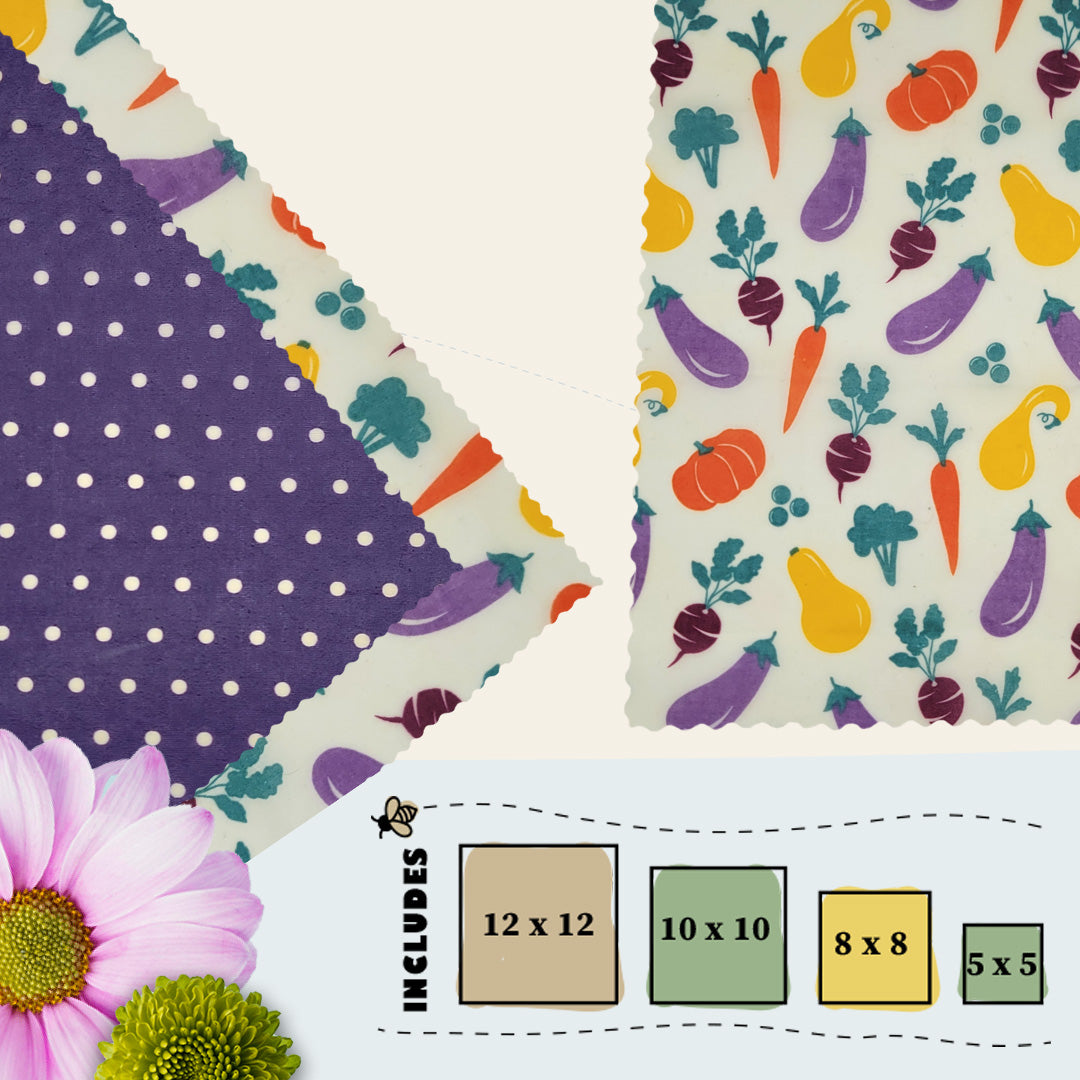 Garden Variety beeswax food wraps in four sizes featuring a vegetable-themed print with carrots, eggplants, squash, and a purple polka dot secondary fabric by Blindhound Farms