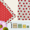 Red apple-themed beeswax food wraps in four sizes with polka dot secondary fabric, displayed flat